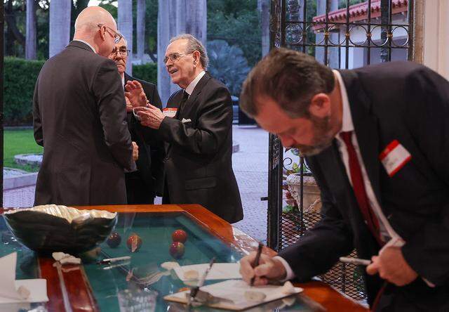 Omar Sixto, center, greets Cuban and Cuban-American entrepreneurs as they arrive for a private event on Tuesday, March 31, 2026, in Miami, Florida, to organize and pledge to invest in Cuba if there is a change in government.