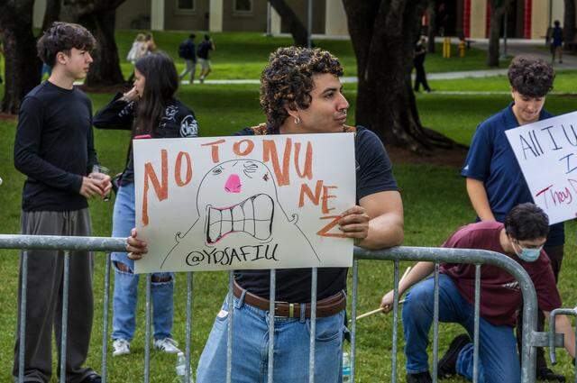 Philosophy/International relations student Michael Andrillon was among a group of people from different campus organizations and several street organizations protested against the university's president Jeanette M. Nuñez, and the association of the campus' police with ICE, in front of the Graham Center at Florida International University, in Miami, on Tuesday, April 07, 2026.