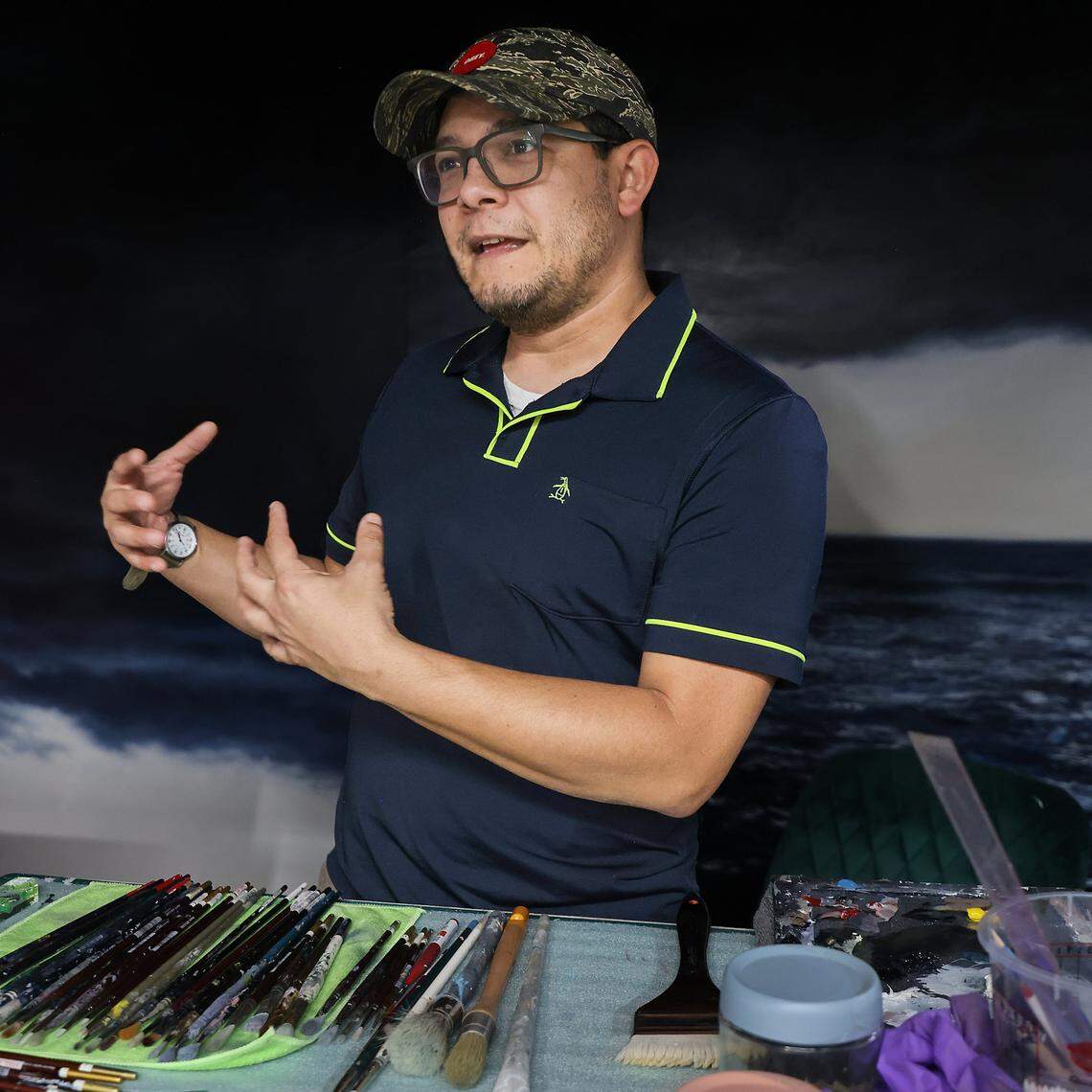 Resident artist David Olivera describes his art practice while waiting for ICA cohorts during a tour of the Tunnel Projects, a multifaceted art space dedicated to supporting local artists on Saturday, April 11, 2026, in Little Havana, Miami, Florida.
