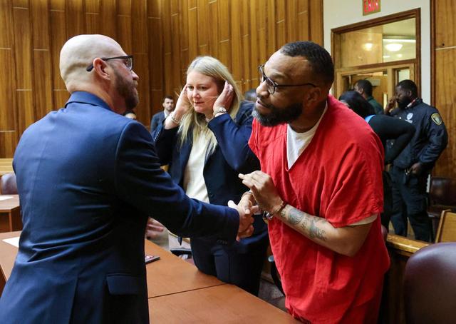 Convicted murderer and gang leader Corey Smith, center, thanks his attorney Craig Whisenhunt after he pleaded guilty to second degree murder on several charges in Courtroom 4-1 at the Richard E. Gerstein Justice Building in Miami, Florida, on Wednesday, February 5, 2025, as the State dropped the former first degree murder charges. Left to Right: Whisenhunt, Allison Miller, and Smith.
