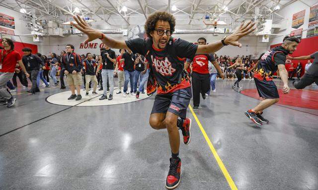 Miami Heat's Hoop Troop member Pix-R reacts as he dances with students. In celebration of Earth Day, the Miami Heat began the day's events with a pep rally featuring the Miami Heat dancers, in-game host Uptown Dale, the Hoop Troop, and Burnie the mascot, at Driftwood Middle School in Hollywood, Florida, on Thursday, April 9, 2026. Miami Heat's efforts aim to bolster Driftwood's environmental programs and curriculum, which have already earned the school national and state recognition.