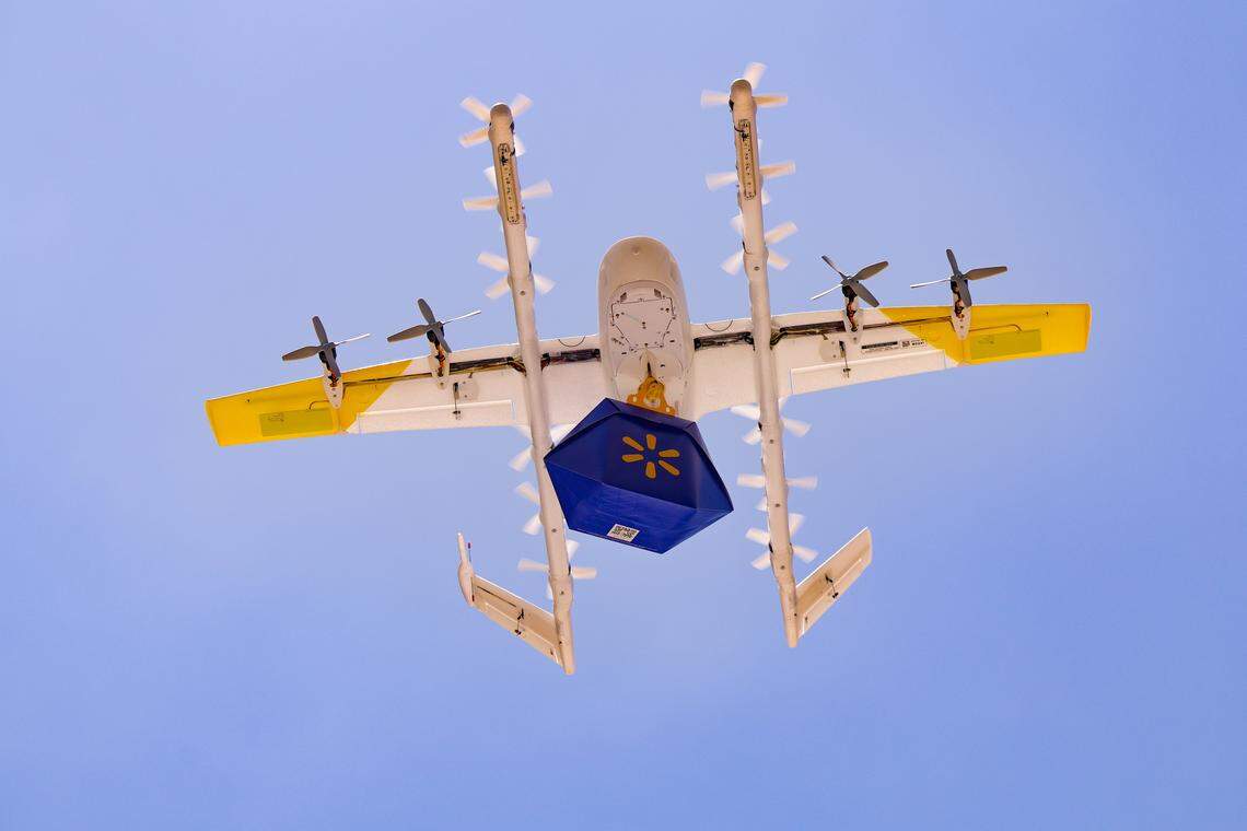 Walmart and Wing demonstrate a drone delivery system during CoMOTION Miami, at Miami Dade College's Wolfson Campus in Miami, Florida, on Tuesday, April 28, 2026. Walmart and Wing expect to launch the new drone delivery service in Miami in 2027 as part of its coast to coast expansion plans. Weighing just over 11 pounds, Wing delivery drones cruise at up to 60 mph about 150 feet above the ground. They then hover at about 23 feet to gently lower orders, ensuring safe delivery without spills or cracks. Walmart products eligible for drone delivery include grocery items, household goods and over-the-counter medicine.