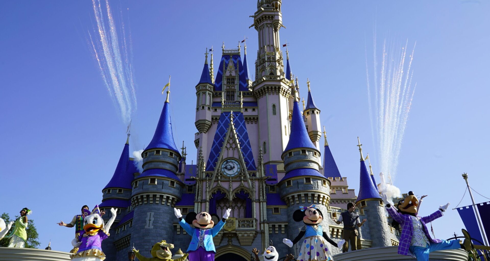 Mickey Mouse and friends perform in front of a Cinderella Castle with fireworks in the background at Magic Kingdom as par of Mickey