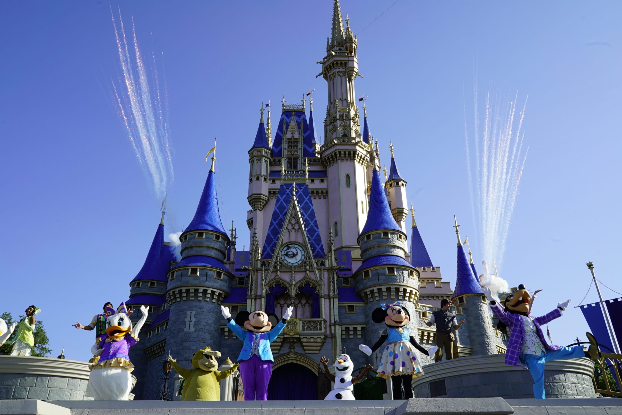 Mickey Mouse and friends perform in front of a Cinderella Castle with fireworks in the background at Magic Kingdom as par of Mickey's Magical Friendship Faire