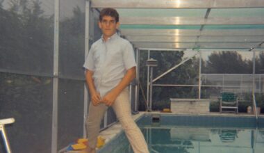 grainy photo of a young boy standing over a pool in the '70s
