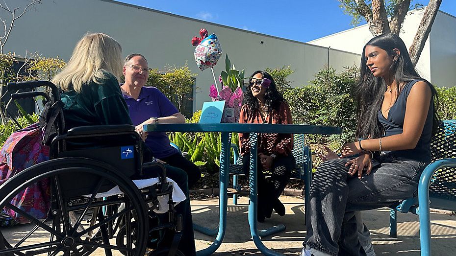 Vaido Jagmohan visits Nancy Vendur with her "Celebration Impact," an initiative she began to reach seniors in nursing homes who don't have many family member visits. (Spectrum News)