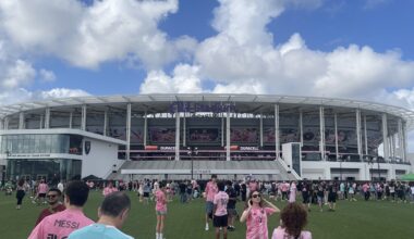 soccer fans walk in front of Miami's new stadium