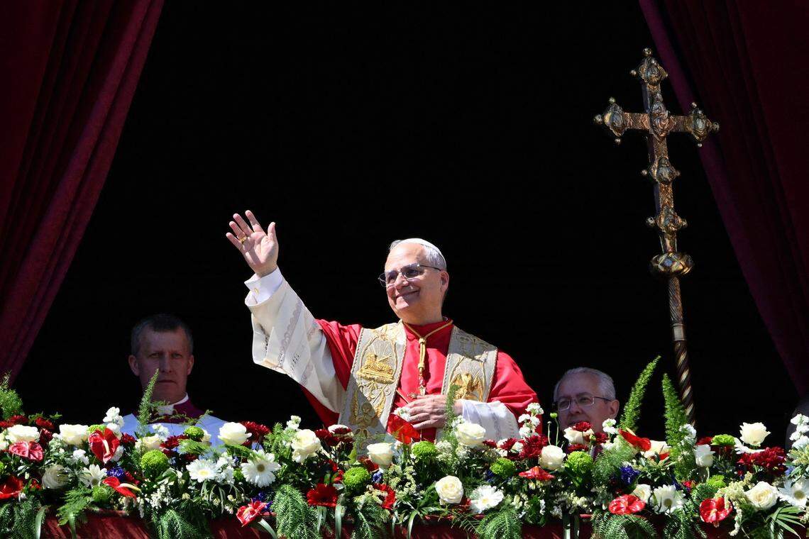 Pope Leo XIV waves to the crowd from the main balcony of St. Peter's basilica for the Urbi et Orbi message and blessing to the city and the world as part of Easter celebrations, at St Peter's square in the Vatican on Sunday, April 5, 2026. 