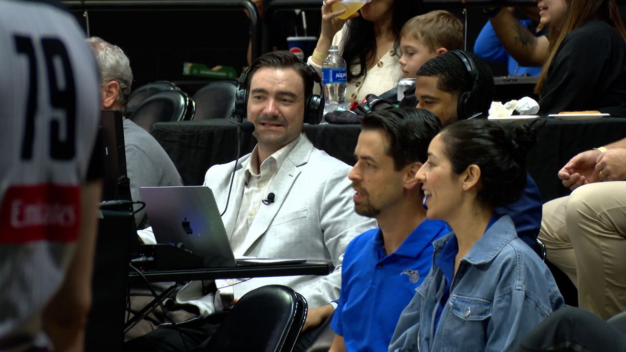 Osceola Magic play-by-play announcer Nick Gryniewicz (middle) calling a game in February against the Cleveland Charge. (Spectrum Sports 360/Brandon Green)