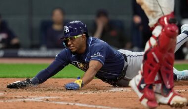 Tampa Bay's Richie Palacios, left, scores in the eighth inning of the Rays' 3-2 win Monday night at Cleveland. (AP Photo/Sue Ogrocki)