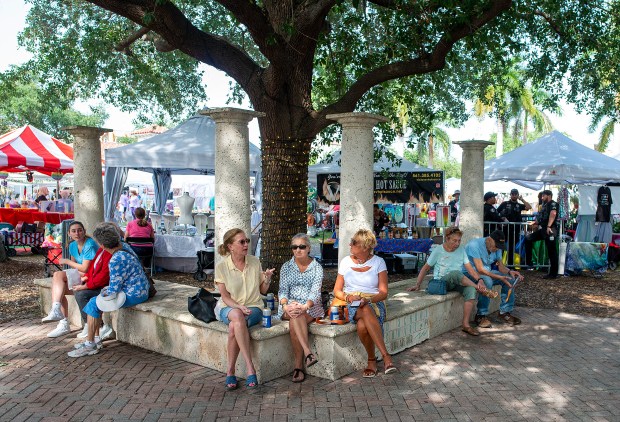 Ladies take a rest during the "Delray Affair" show, Friday, April 8, 2022. The Greater Delray Beach Chamber of Commerce is celebrating the 60th year of the Delray Affair. Nicknamed the "Greatest Show under the Delray Sun." From April 8th through April 10th, the Downtown is alive during the day with an eclectic mixture of fine art, great crafts, and funky products from around the world.