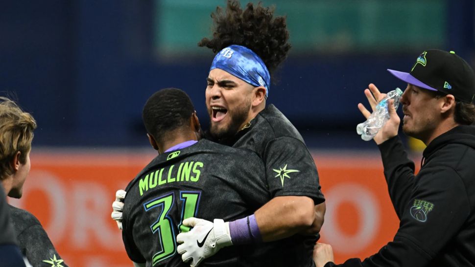 Tampa Bay Rays' Cedric Mullins (31) and Jonathan Aranda celebrate after Aranda's RBI walk-off single during the tenth inning of a baseball game against the New York Yankees Saturday, April 11, 2026, in St. Petersburg, Fla. (AP Photo/Jason Behnken)