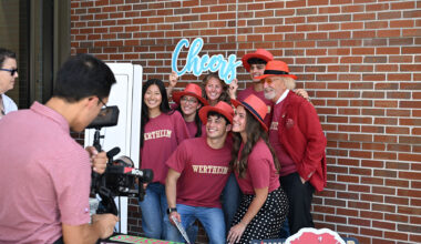 The speakers for Red Hat Day pose in their red hats from left, Wertheim College Dean Michael D. Hartline, Dr. Herbert Wertheim, student Jaclyn Madson and FSU President Richard McCullough.