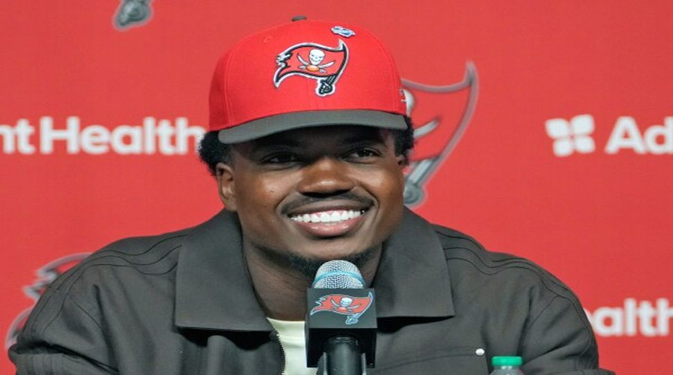 Rueben Bain Jr., selected 15th overall in the first round of the NFL football draft by the Tampa Bay Buccaneers, smiles during a news conference Friday, April 24, 2026, in Tampa, Fla. (AP Photo/Chris O'Meara)