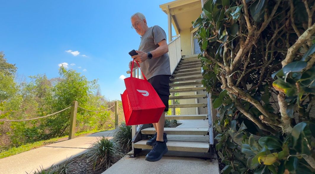 Retiree Mitch Stein, 76, says he started working for DoorDash to supplement his income. (Spectrum News/Ashley Engle)