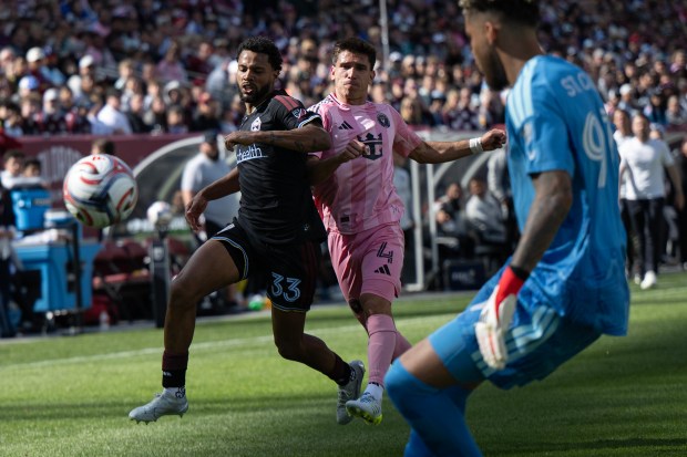 Defender Kosi Thompson (33) of the Colorado Rapids gets knocked over by defender Facundo Mura (4) of the Inter Miami CF on Saturday, April 18, 2026, at Empower Field at Mile High in Denver. (Photo by Timothy Hurst/The Denver Post)