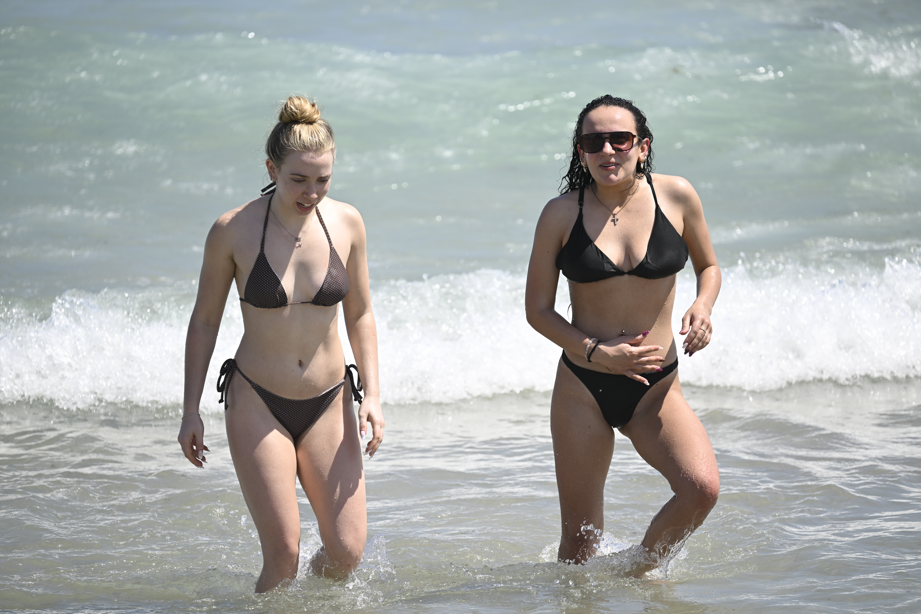 Emma Costello, left, and Mikayla Brown, of Connecticut, visit the...