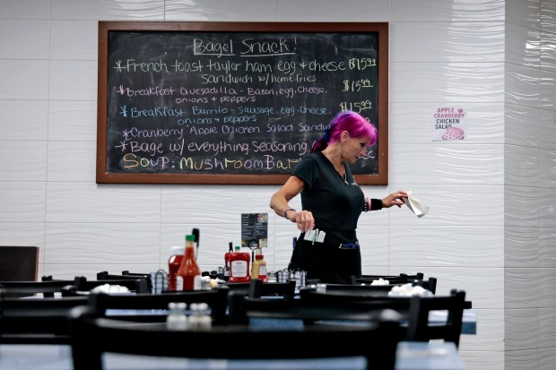 Server Alina Zitti works in the dining room at Bagel Snack in Pompano Beach on Monday, April 6, 2026. The restaurant is the Best of South Florida Dining winner for best deli and also won best bagels in 2024. (Amy Beth Bennett / South Florida Sun Sentinel)