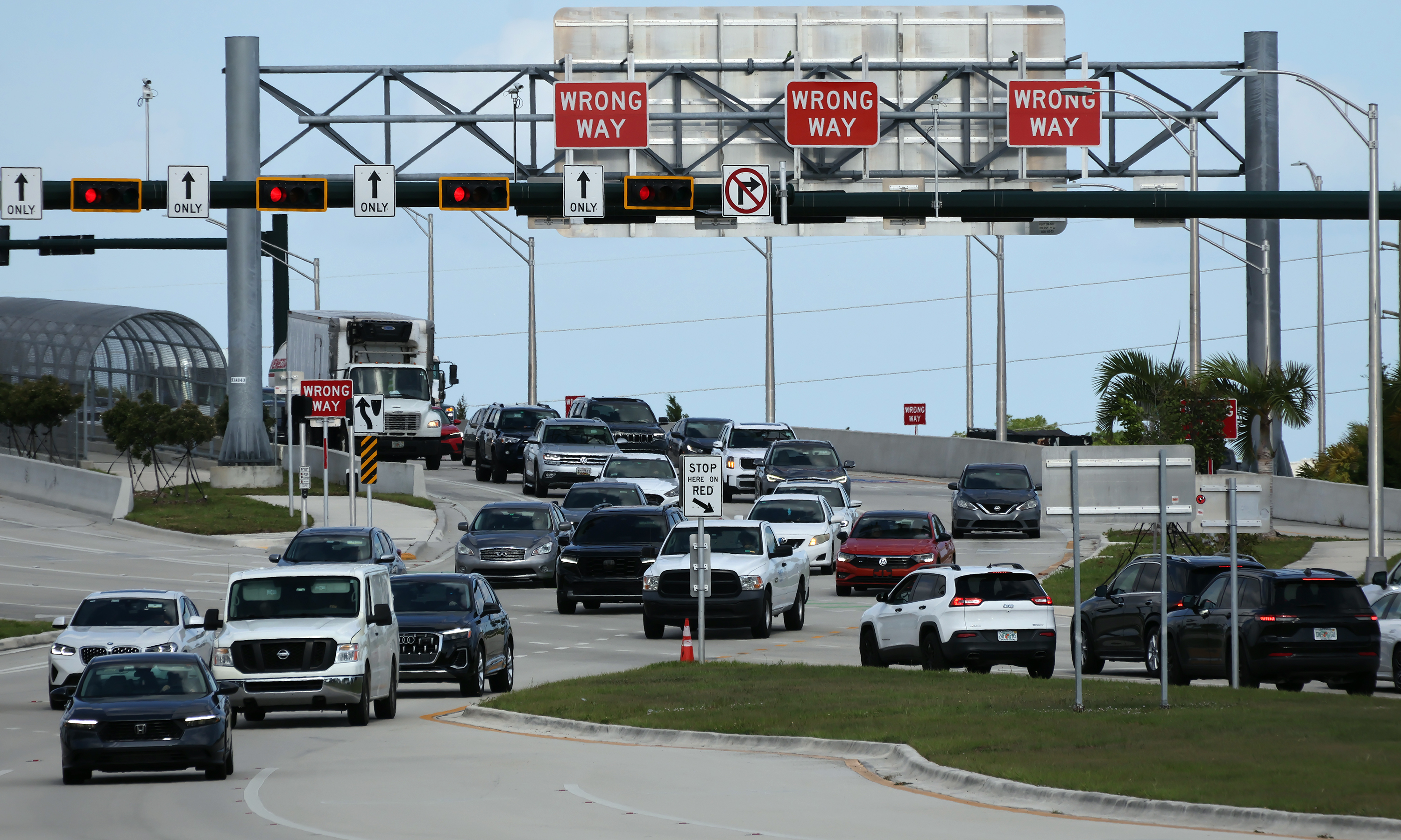 Vehicles navigate the I-95 and Glades Road diverging diamond interchange...