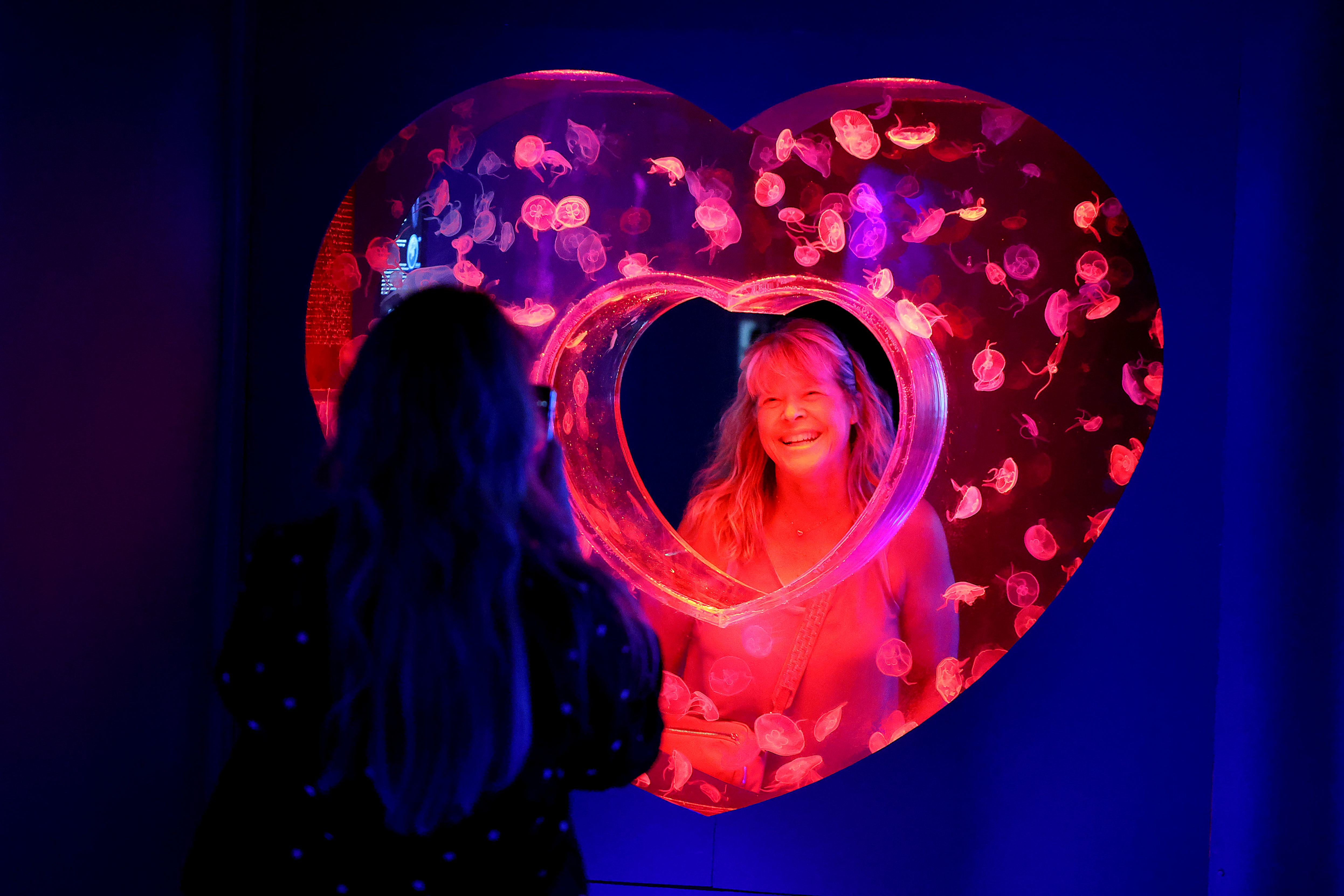 Jan Smith takes photos of her friend, Valerie Gonzalo, at...