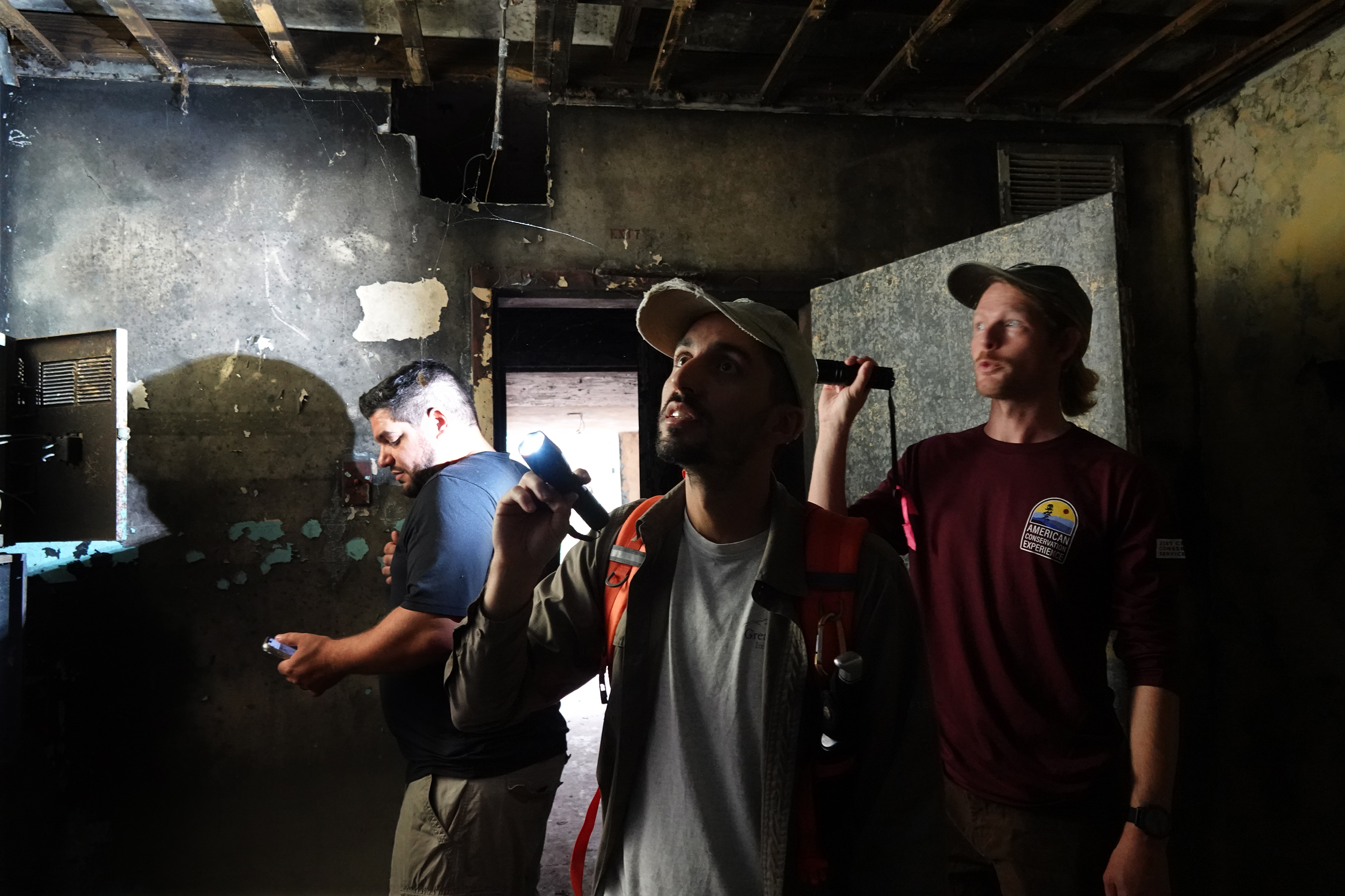 Mike Cove, from left, A.J. Sanjar, and Isaac Lord inspect...