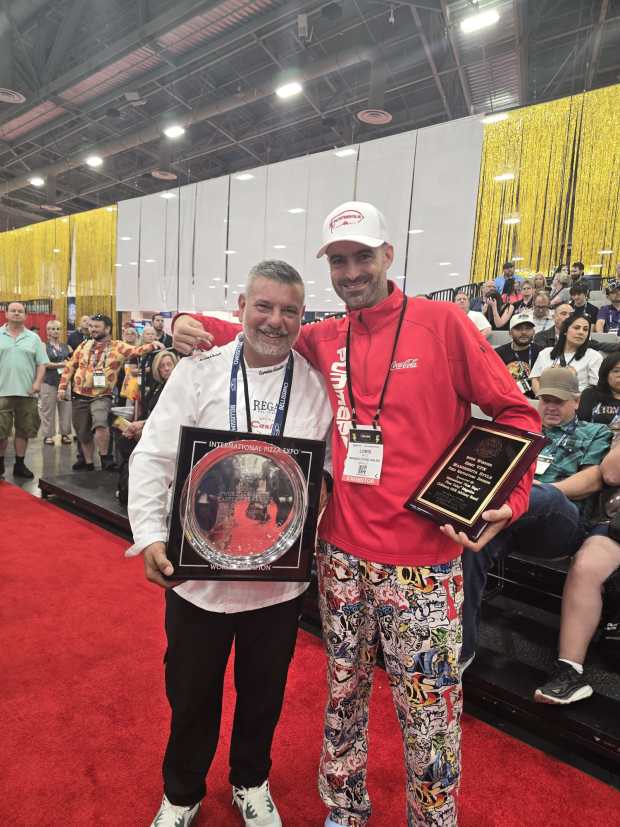 (l. to r.) Carmine Candito of O' Munaciello Pizzeria and Loris Mele with Pummarola Pizzeria Napoletana at the International Pizza Expo & Conference in Las Vegas. (Pummarola Pizzeria Napoletana/Courtesy)