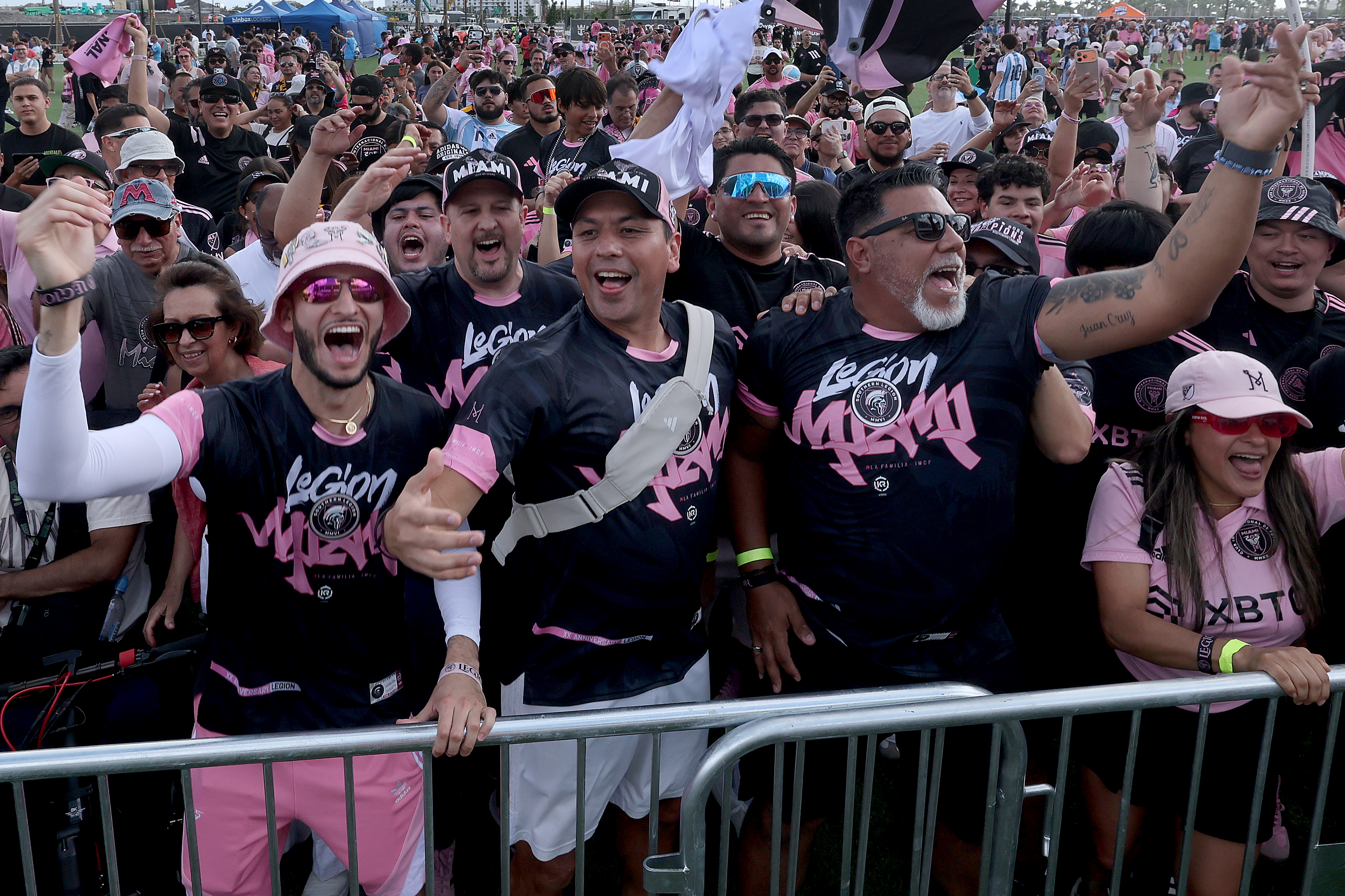 Fans line up and cheer outside Inter Miami Nu Stadium...