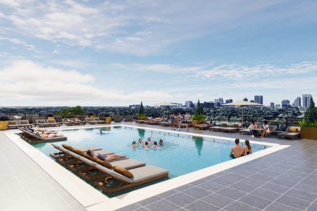 The rooftop amenity deck over the parking garage at Emi on 50 includes a pool with cabanas and covered lounge areas. (Rendering by Baker Barrios)