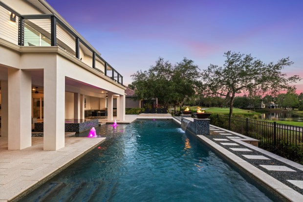 The original pool was fairly small, but the sellers expanded and upgraded it with a large spa and extended lap lane. (Photo courtesy of Pozek Group)