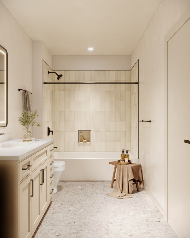 Bathrooms in apartments at The Regency are spacious with lighted mirrors and granite countertops. The luxury apartment community in Ocoee plans to have its grand opening July 7, 2026. (Rendering from FK Architecture/Selnik Development)
