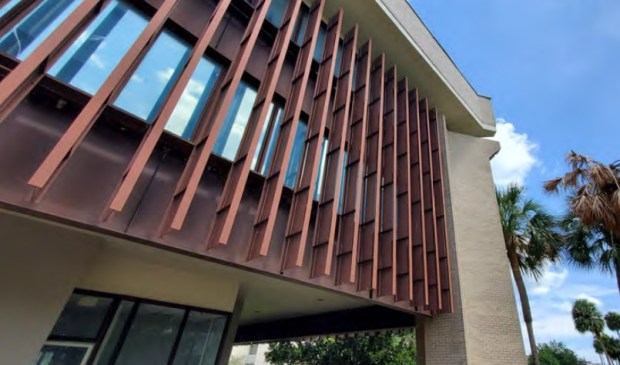The vertical louvers that cover the windows on the former chamber building will be removed and replaced with a perforated metal screen system. The brick will be whitewashed or painted. (City of Orlando)