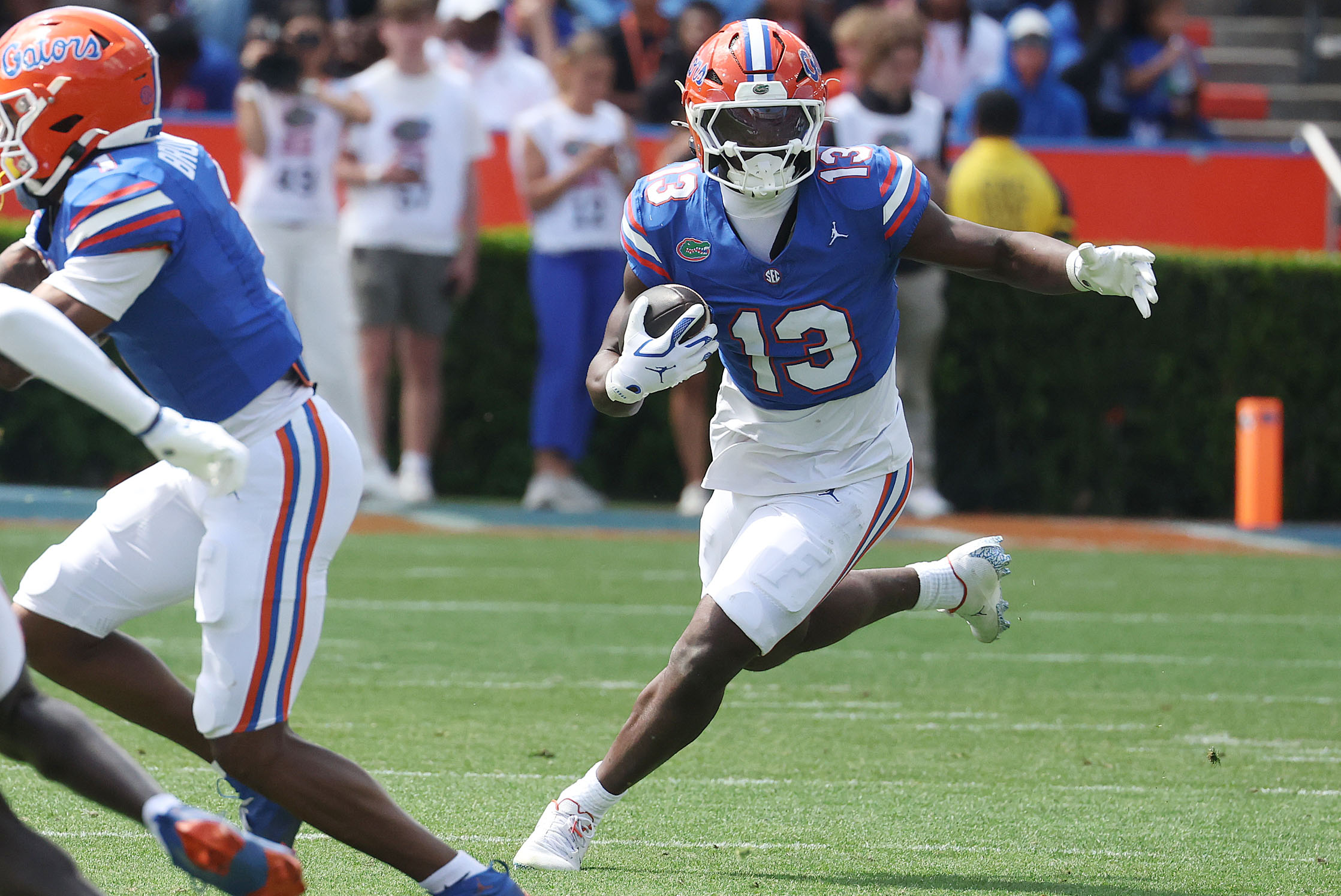 University of Florida running back Jadan Baugh (13) runs during...