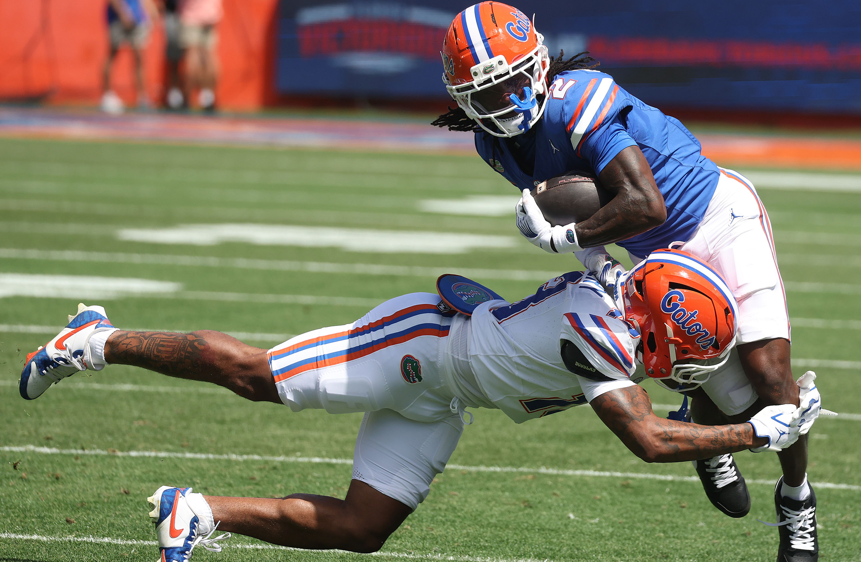 University of Florida receiver Eric Singleton Jr. (2) runs over...