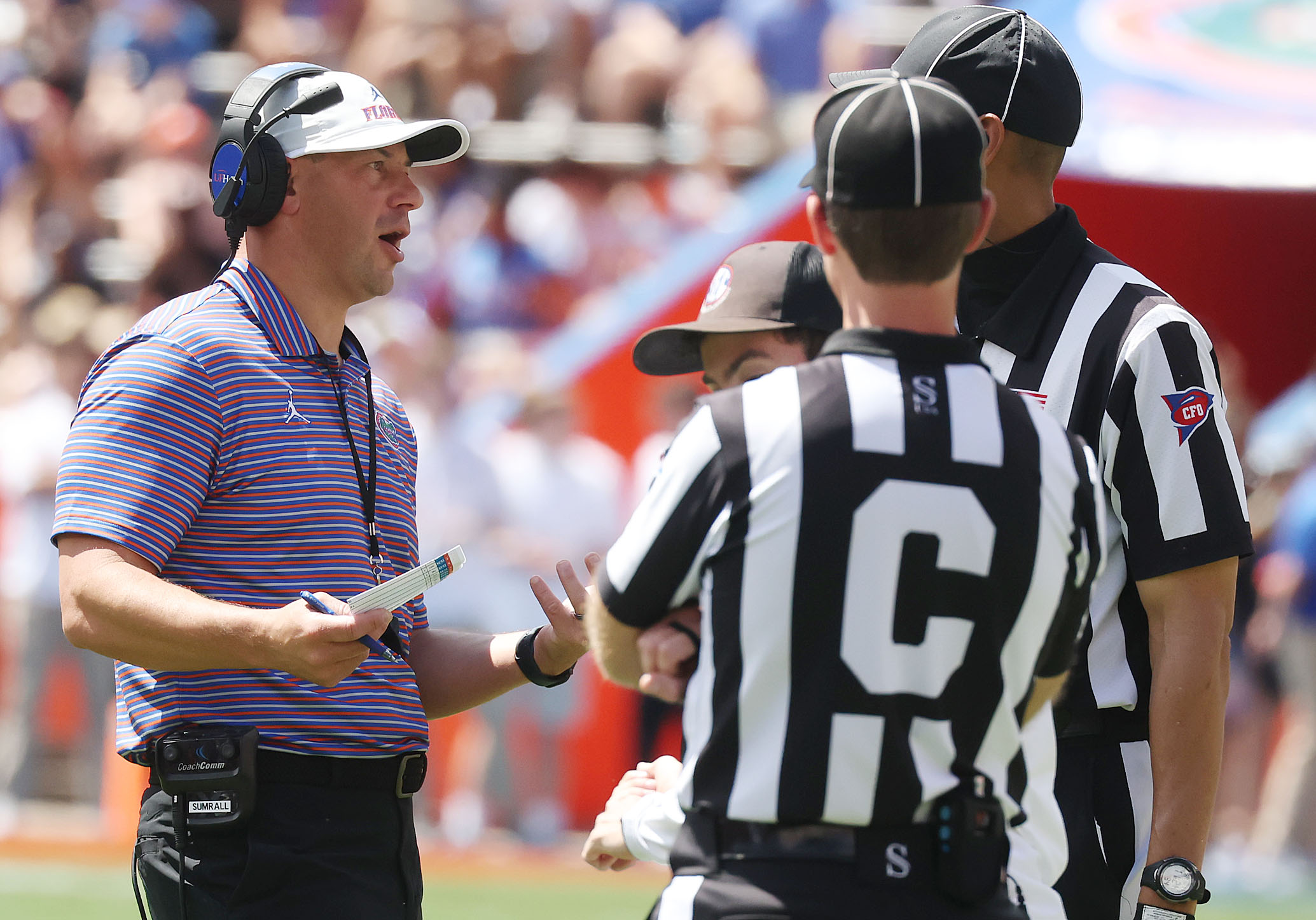 University of Florida head coach Jon Sumrall talks to game...