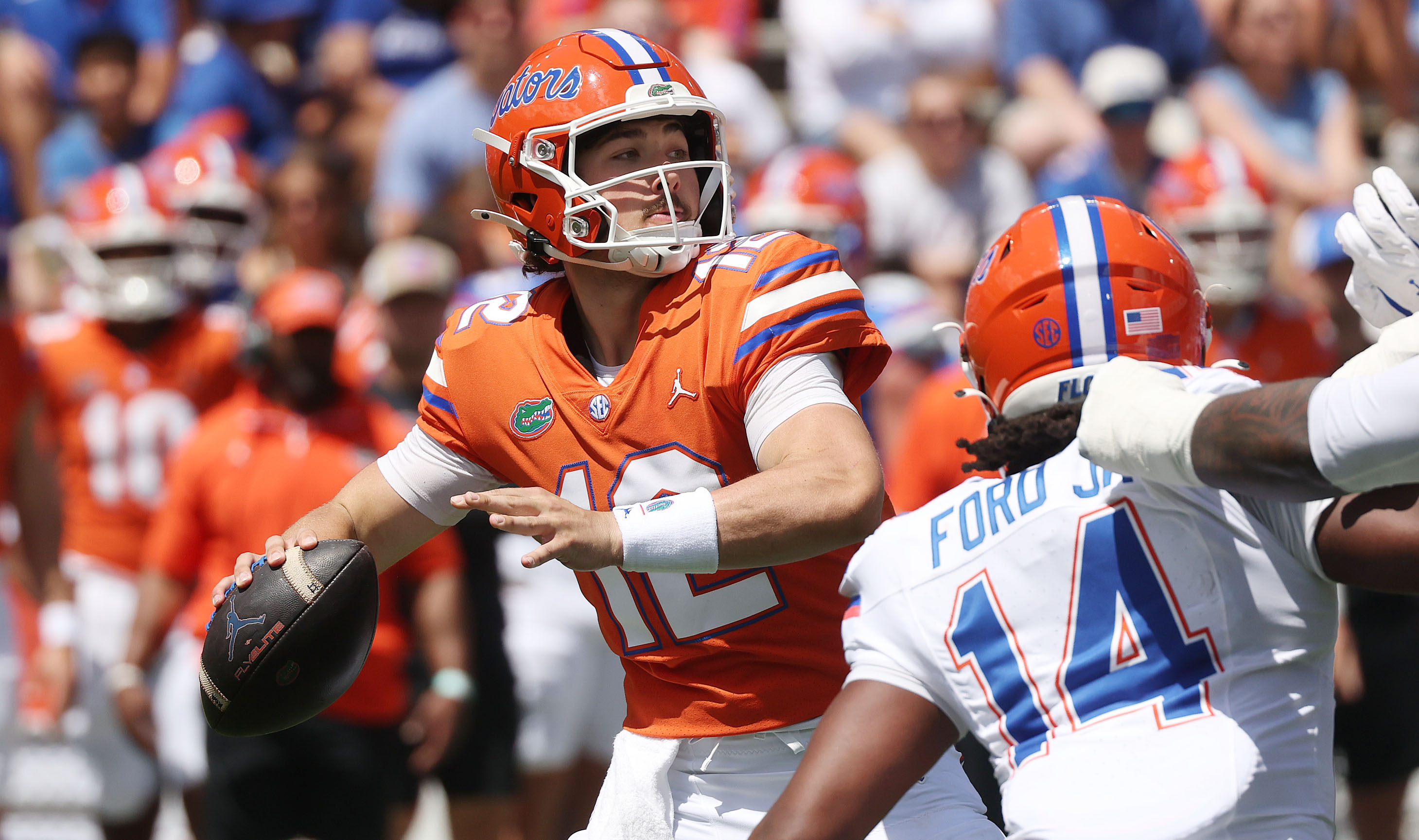 University of Florida quarterback Aaron Philo (12) winds up to...