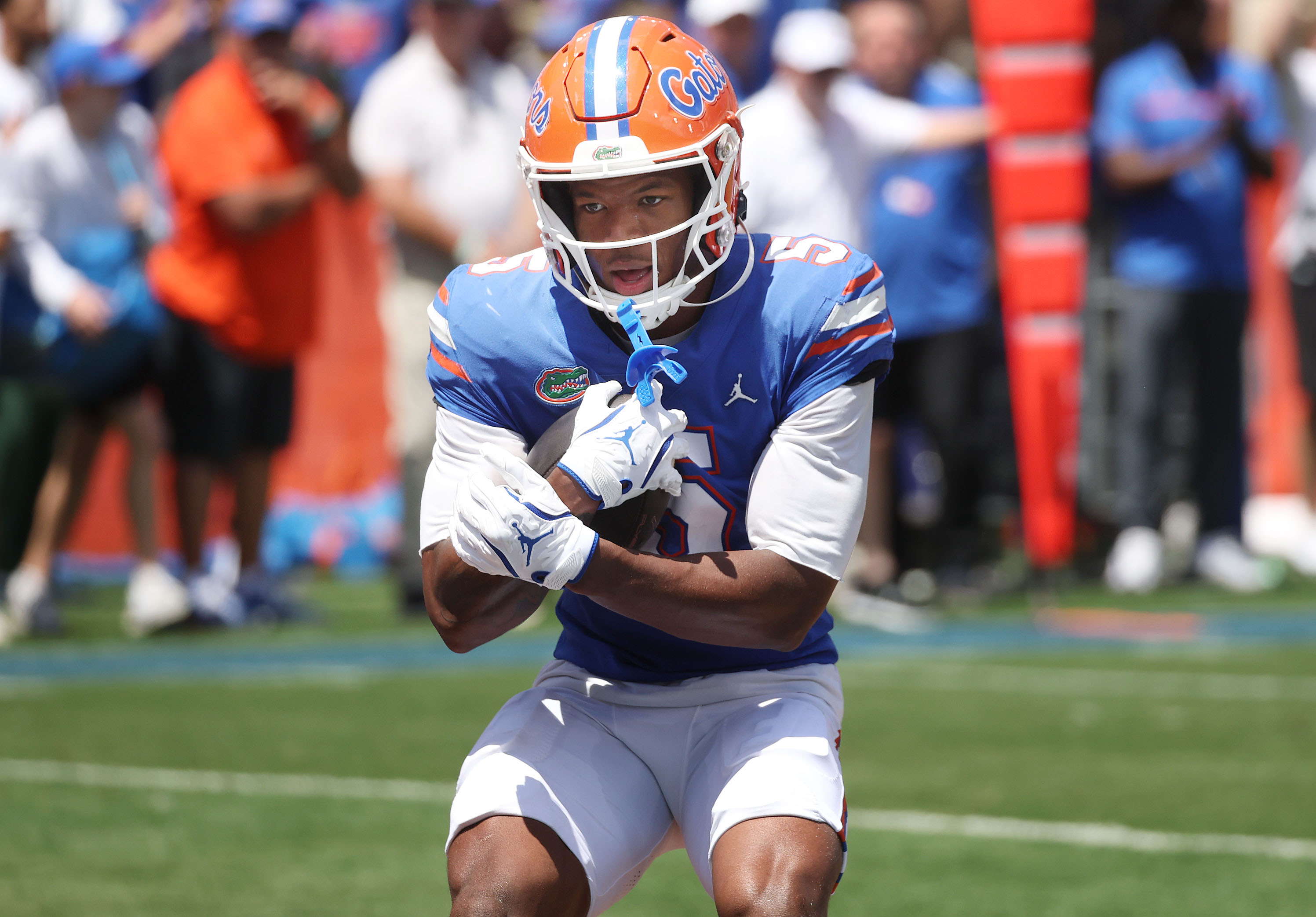 University of Florida wide receiver Micah Mays Jr. holds onto...