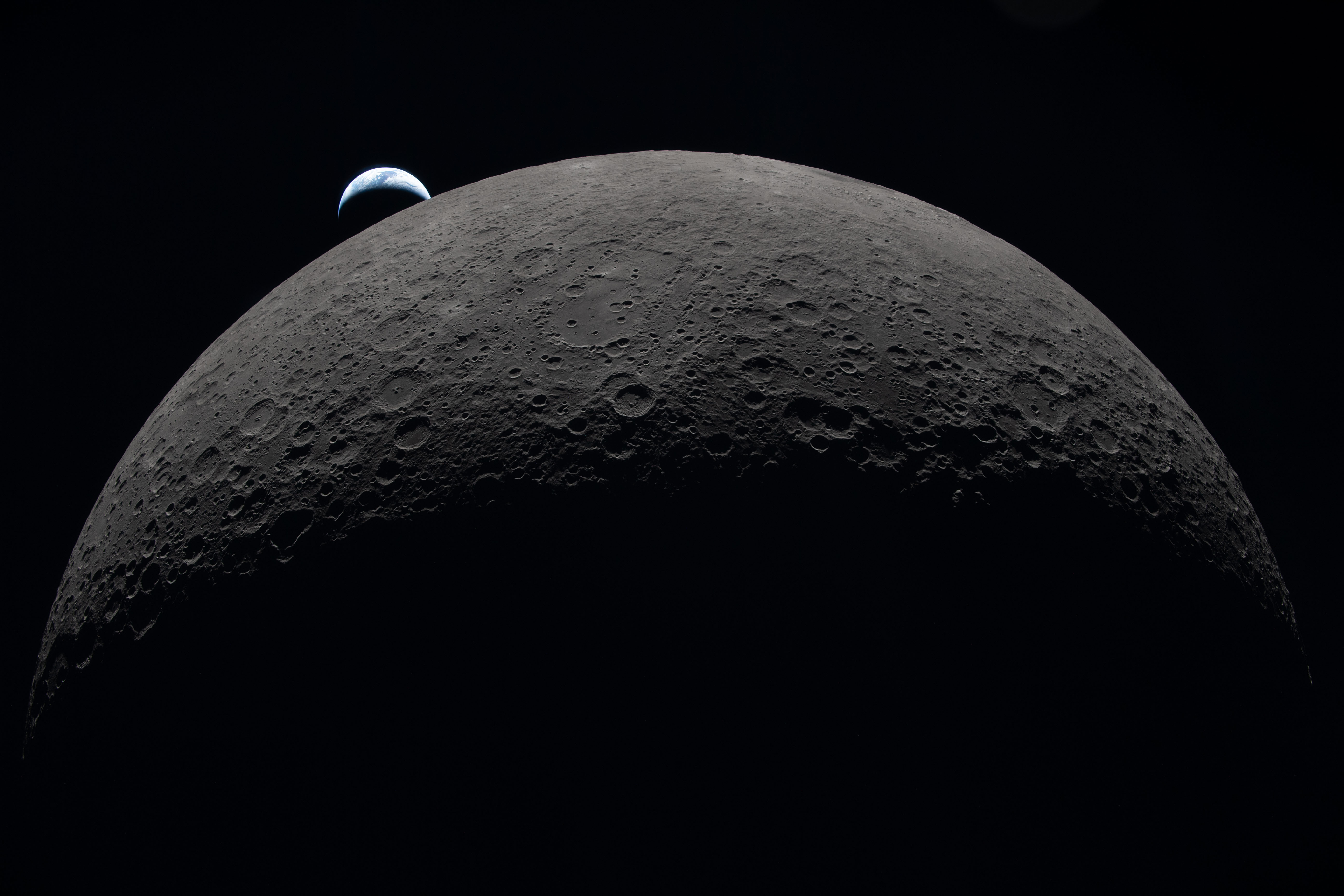 Earth sets at 6:41 p.m. EDT, April 6, 2026, over...