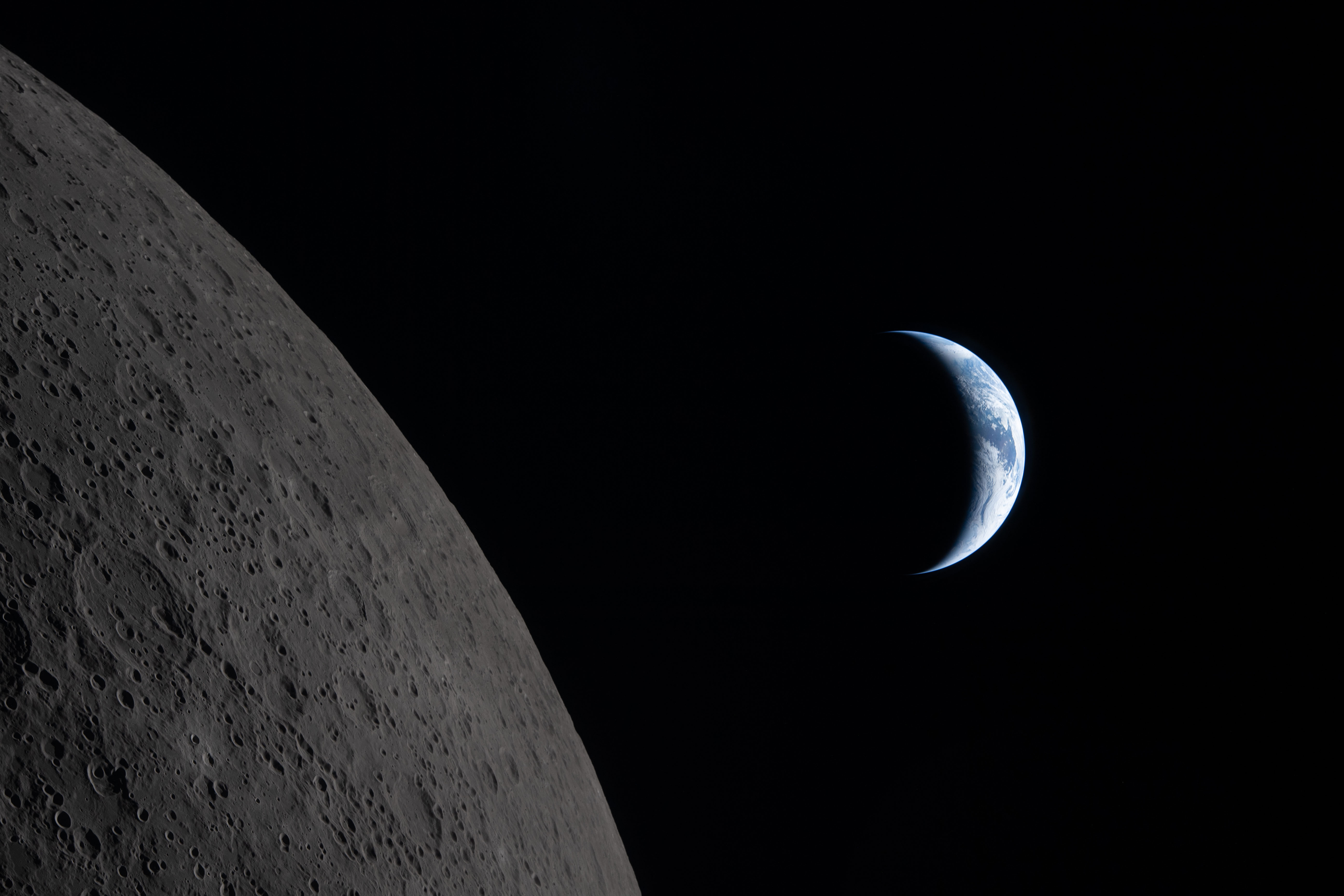 Earth draws closer to passing behind the moon in this...