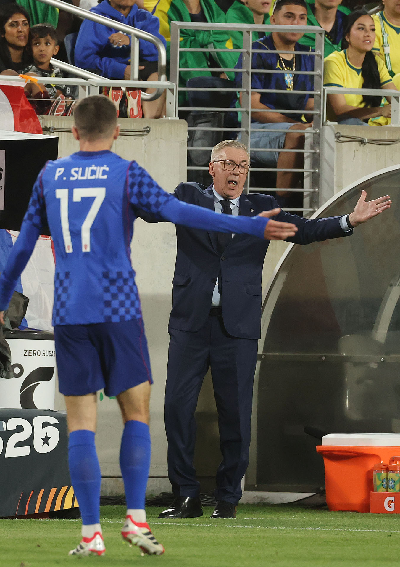 Croatia coach Zlatko Dalic coaches player Petar Sucic (17) during...