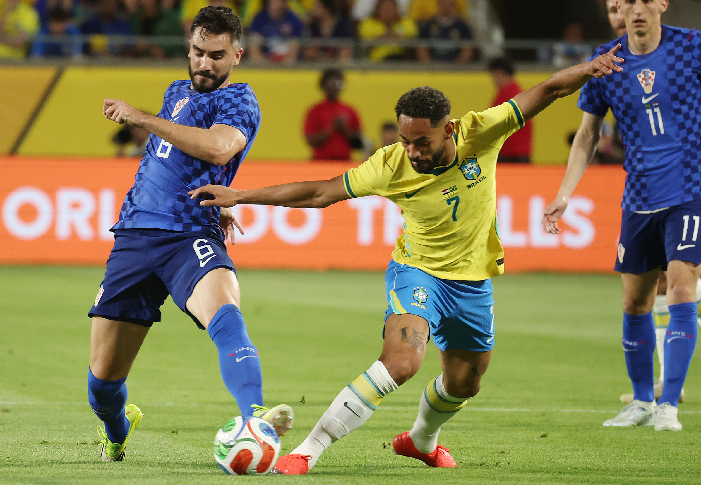 Croatia player Josip Sotalo (6) and Brazil player Matheus Cunha...