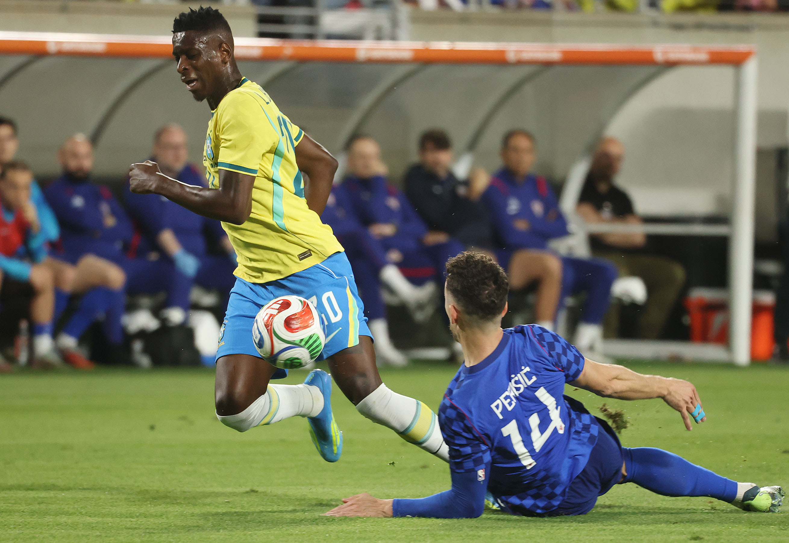 Brazil player Luiz Henrique (20) moves the ball ahead of...
