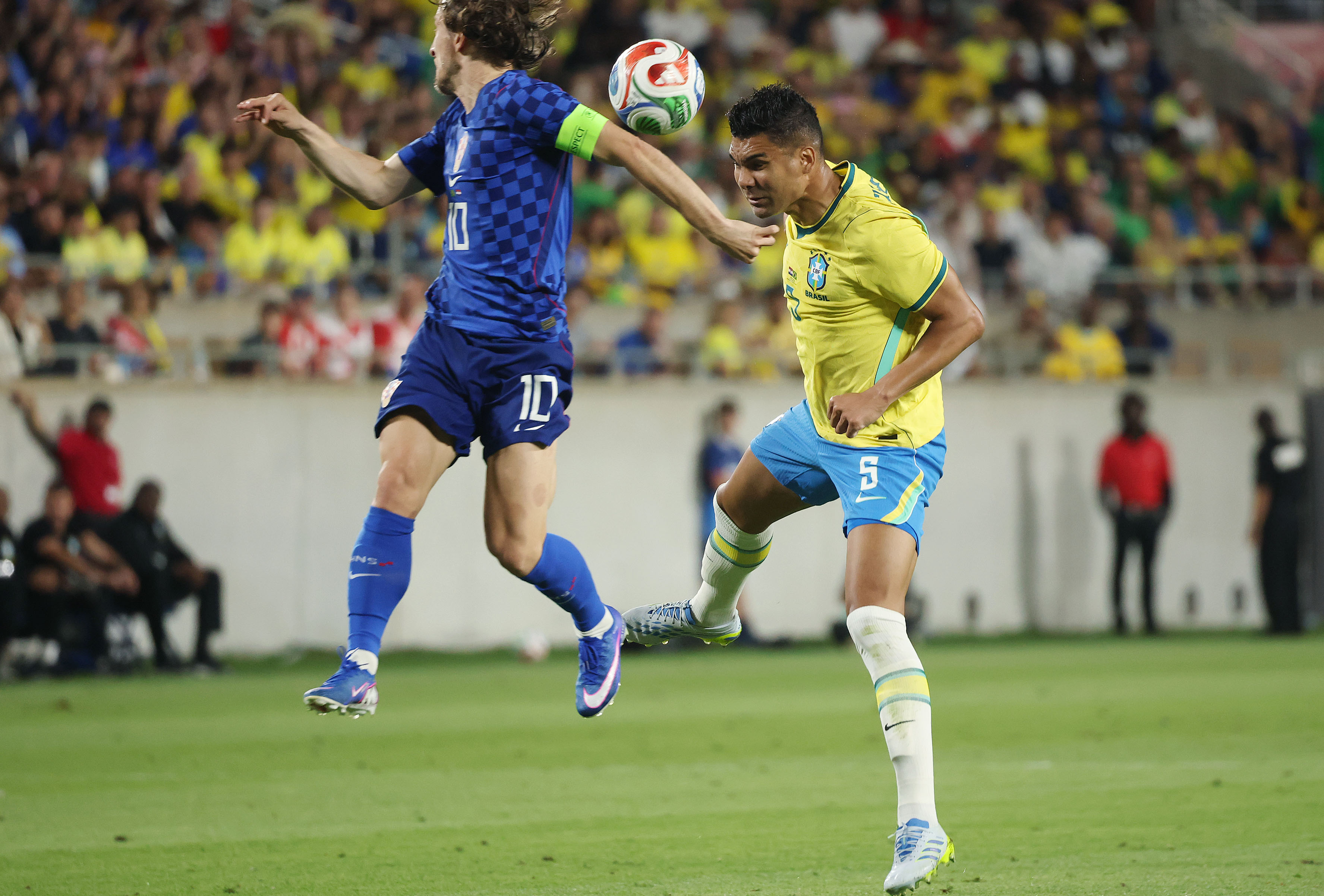 Croatia player Luka Modric (10) and Brazil player Casemiro (5)...