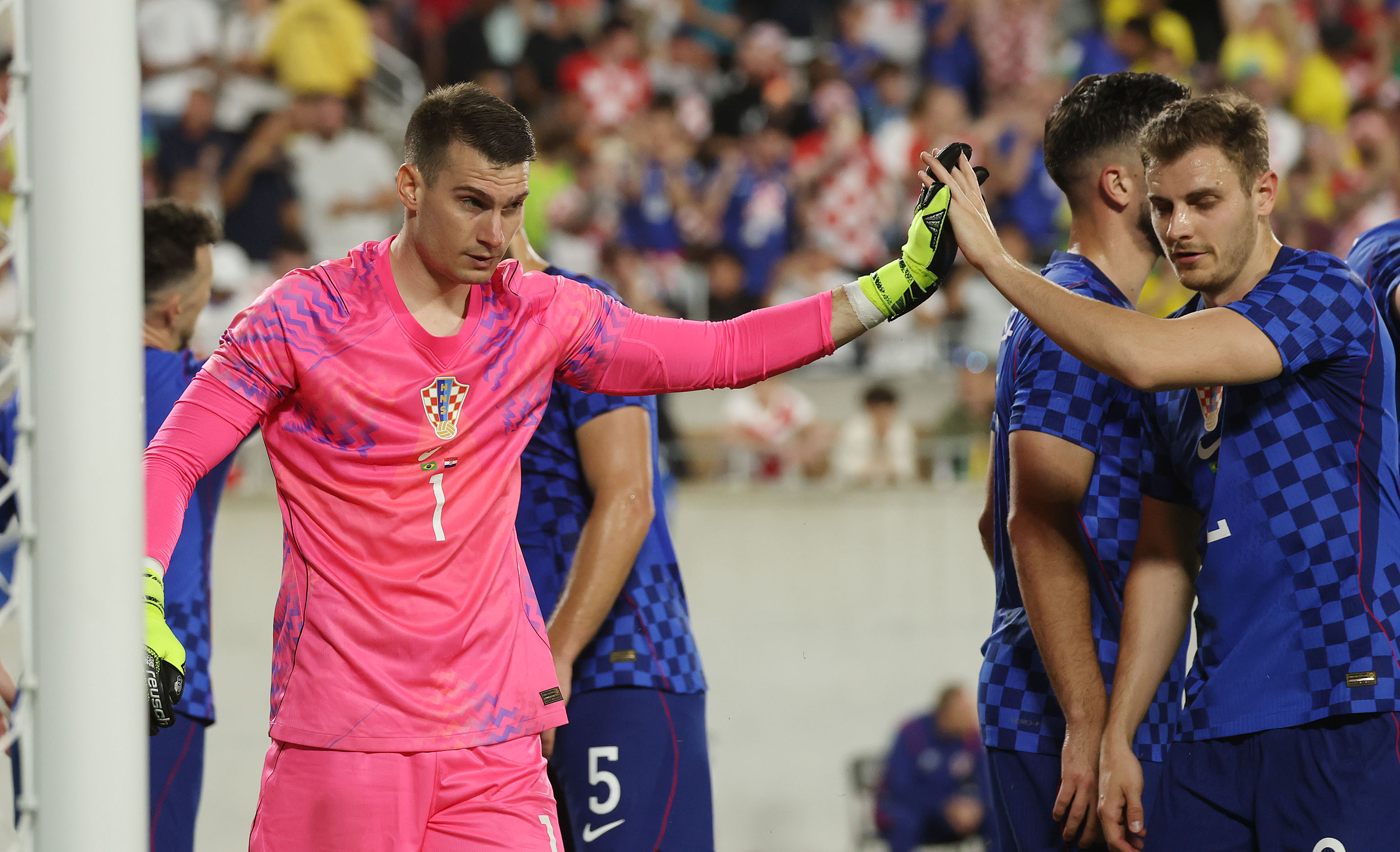 Croatia goalkeeper Dominik Likakovic (1) celebrates after a save during...
