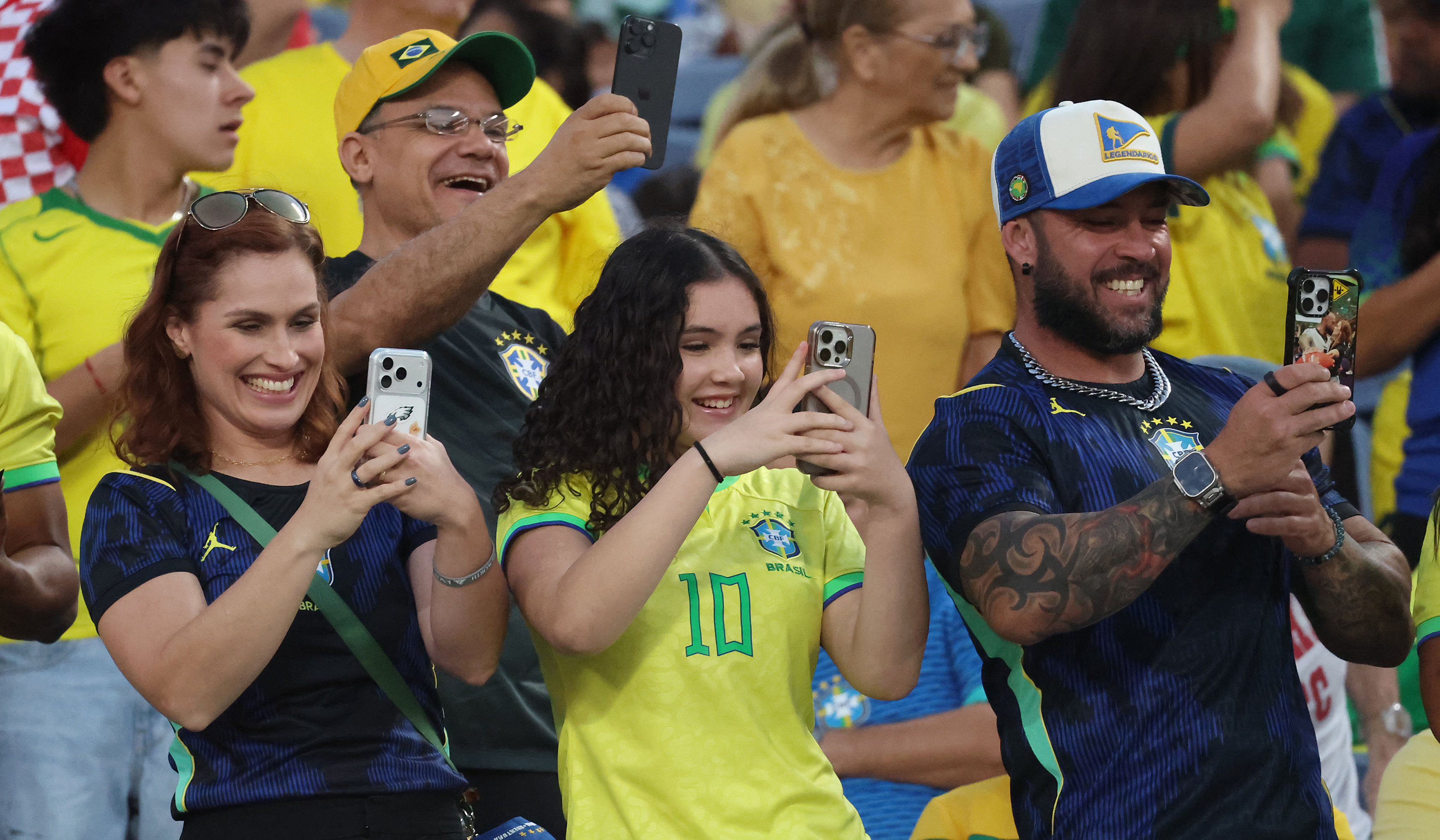 Fans take pictures during the Brazil vs. Croatia Road to...
