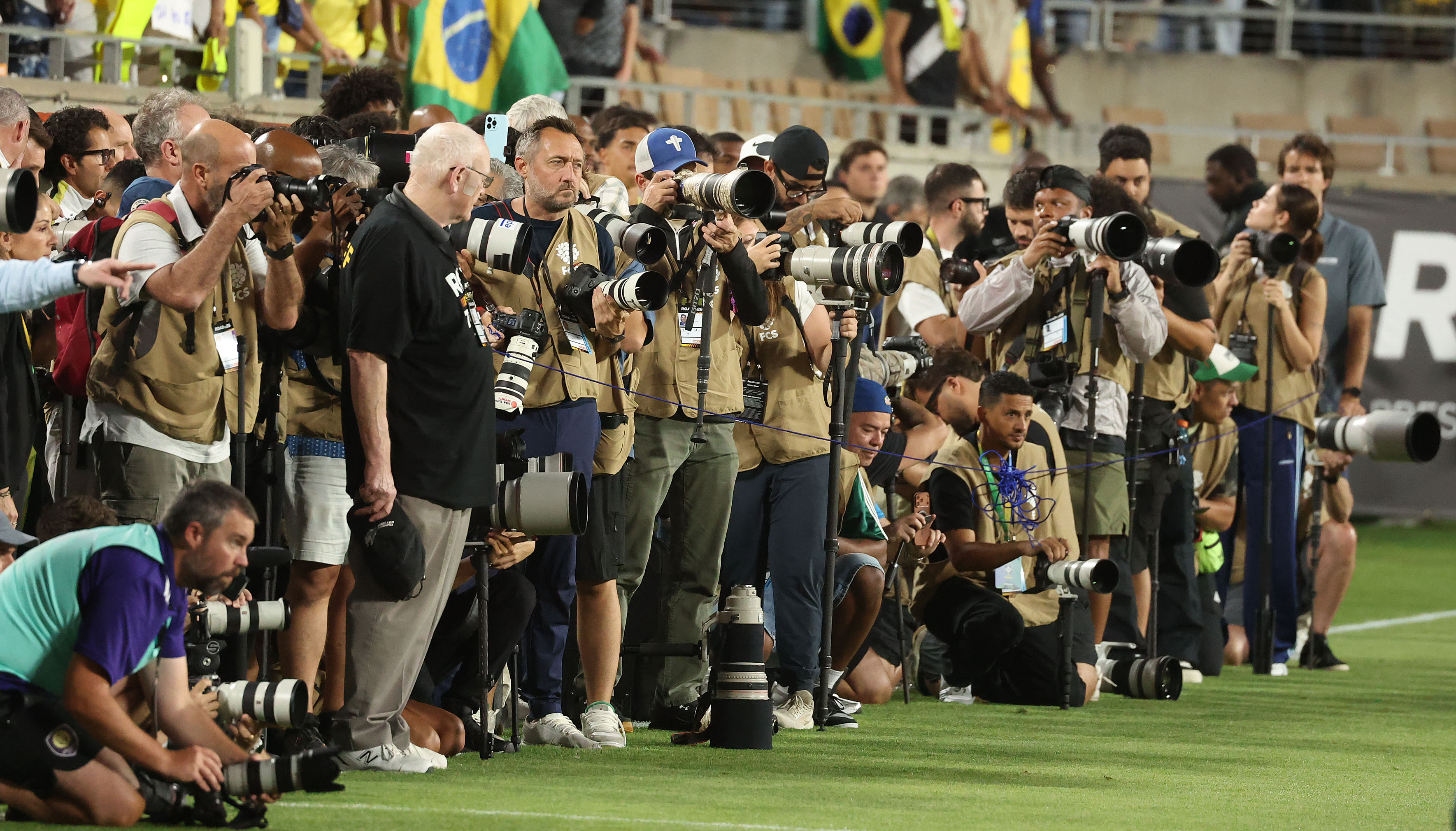 Photographers are lined up during the Brazil vs. Croatia Road...