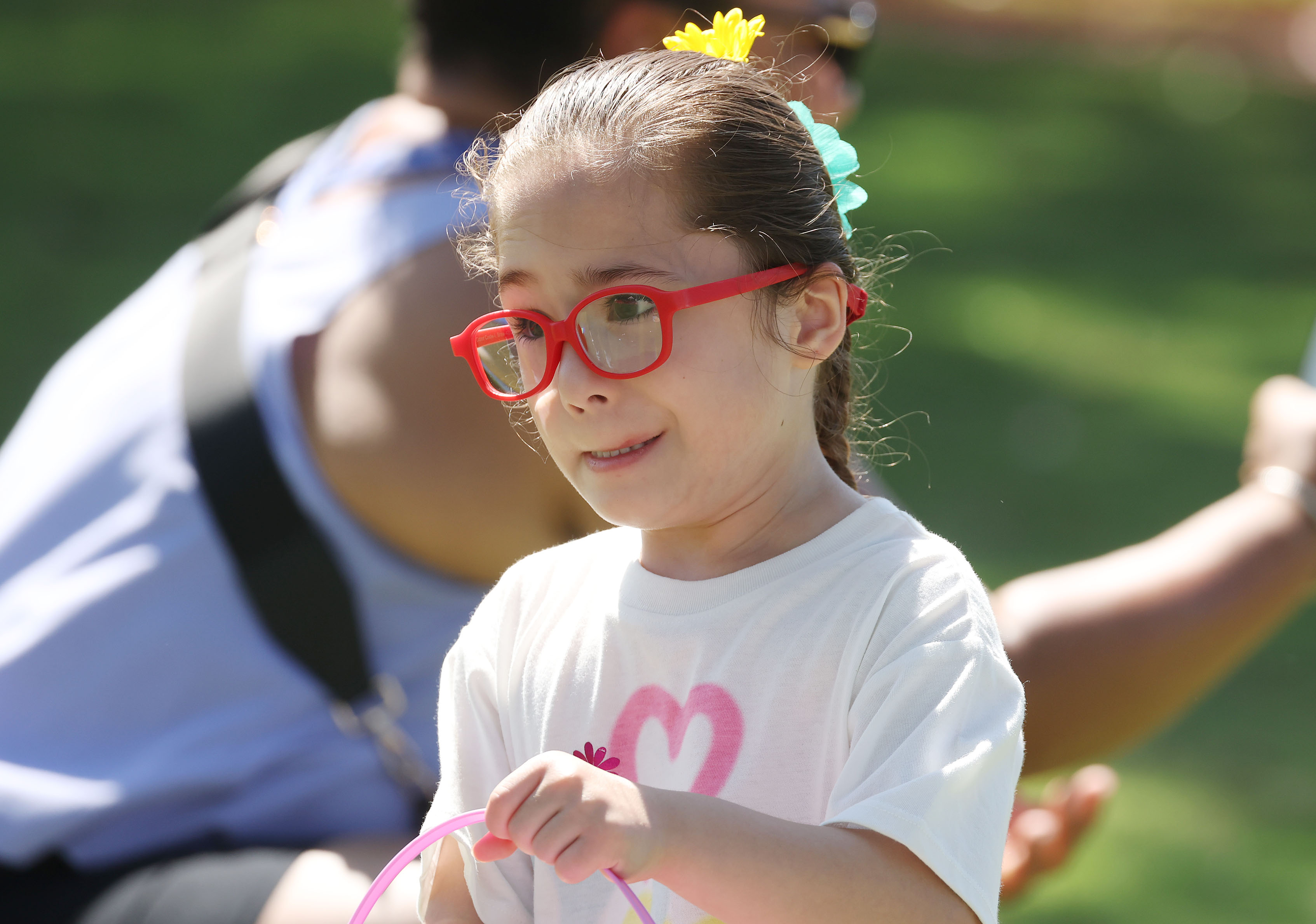 A girl hold her basket during the special needs Easter...