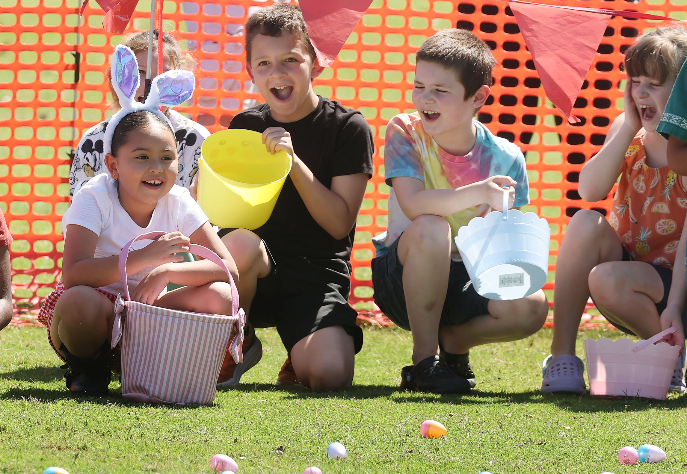 Happy children await the start of the Easter egg hunt...
