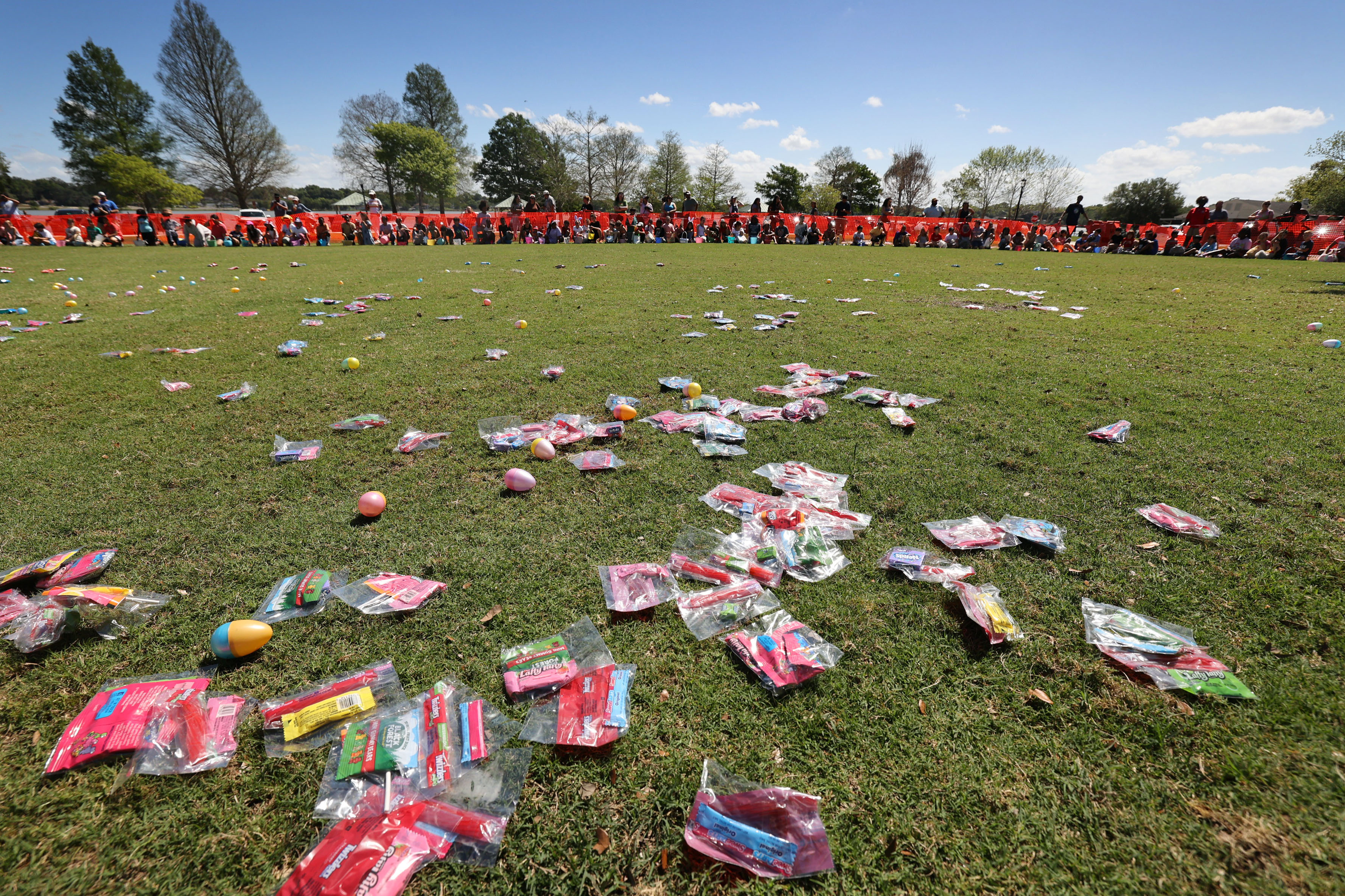 A long line of kids waits in the background to...