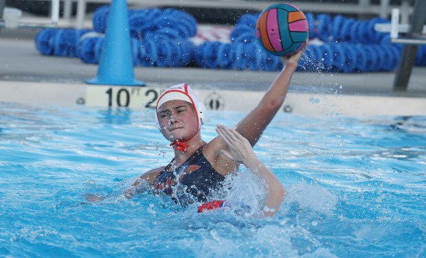 Seminole player Vivian Swain passes during the West Orange High versus Seminole High girls water polo match at the National Training Center in Clermont on Tuesday, March 10, 2026. (Stephen M. Dowell/Orlando Sentinel)