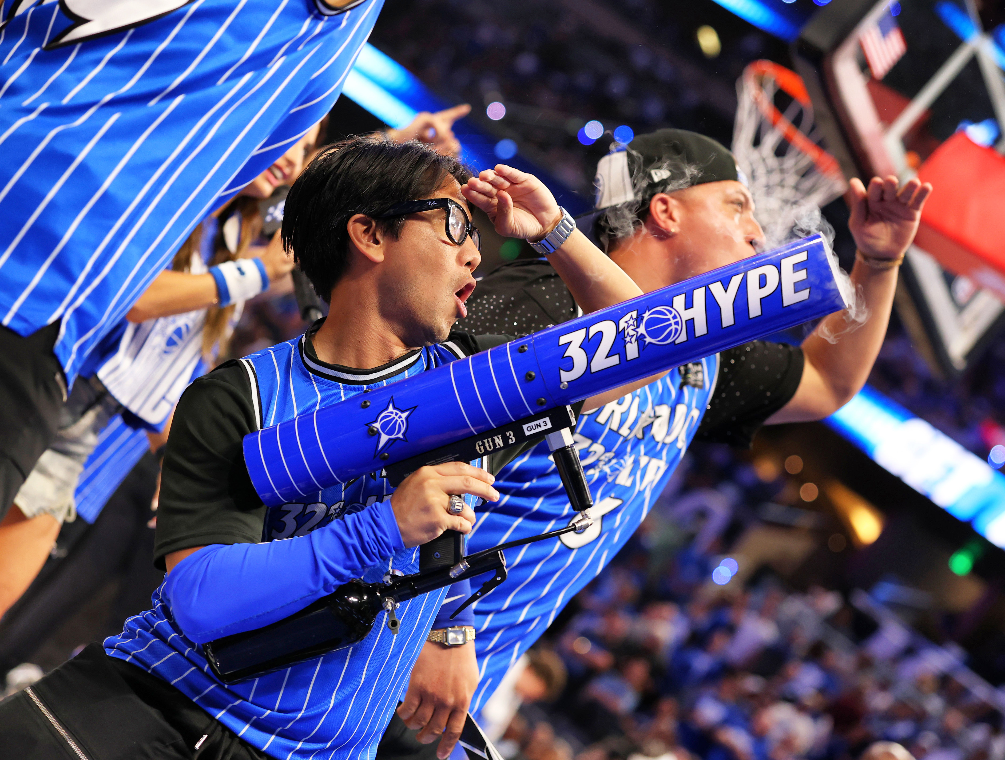 The Orlando Magic 321 Hype squad lead cheers during Game...